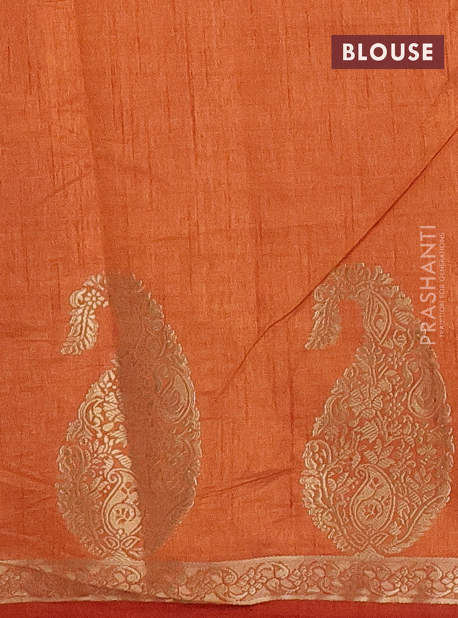 Semi raw silk saree rust shade with plain body and paisley design zari woven butta border