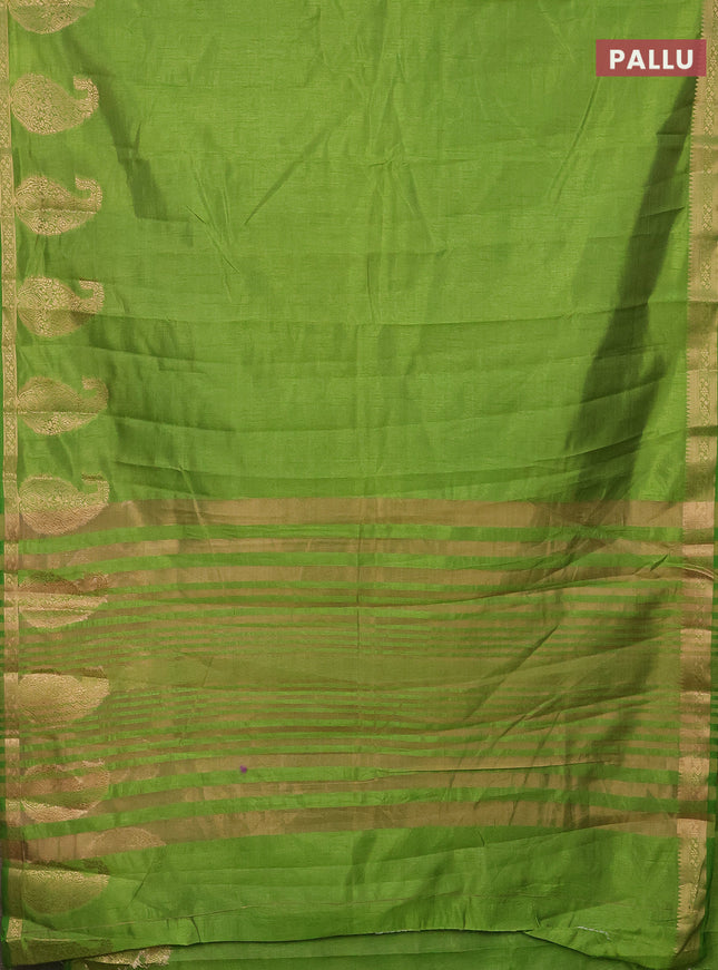 Semi raw silk saree green with plain body and paisley design zari woven butta border