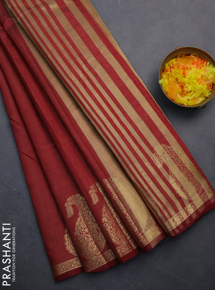 Semi raw silk saree maroon with plain body and paisley design zari woven butta border