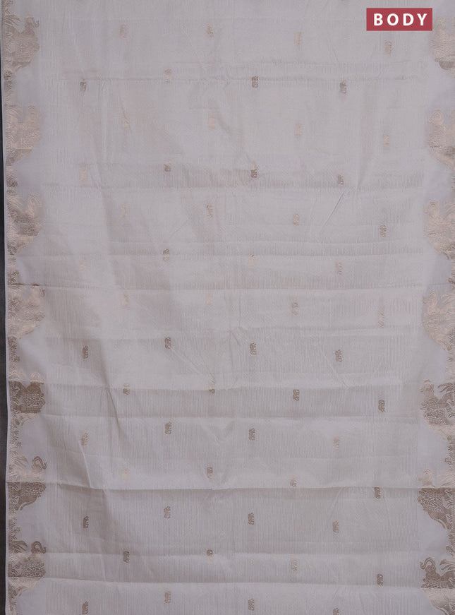 Semi raw silk saree off white with zari weaves & elephant buttas and elephant design zari woven border