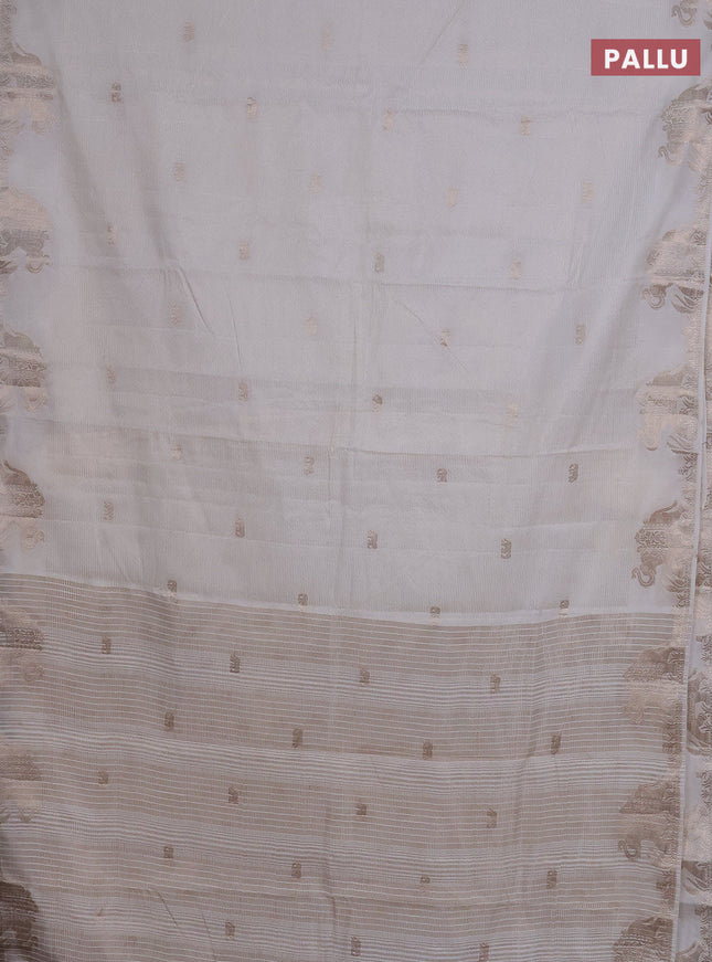 Semi raw silk saree off white with zari weaves & elephant buttas and elephant design zari woven border