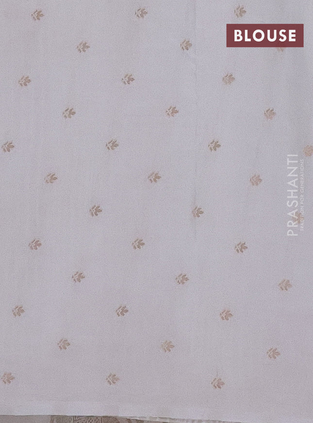 Semi raw silk saree off white with zari weaves & elephant buttas and elephant design zari woven border