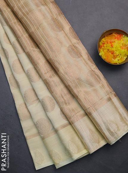 Semi raw silk saree cream with zari woven buttas and zari woven simple border