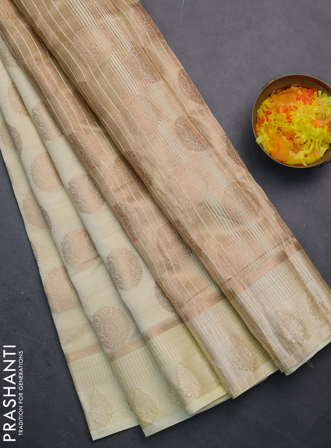 Semi raw silk saree cream with zari woven buttas and zari woven simple border