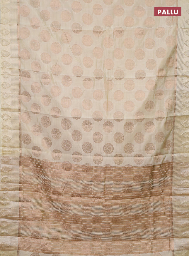 Semi raw silk saree cream with zari woven buttas and zari woven simple border
