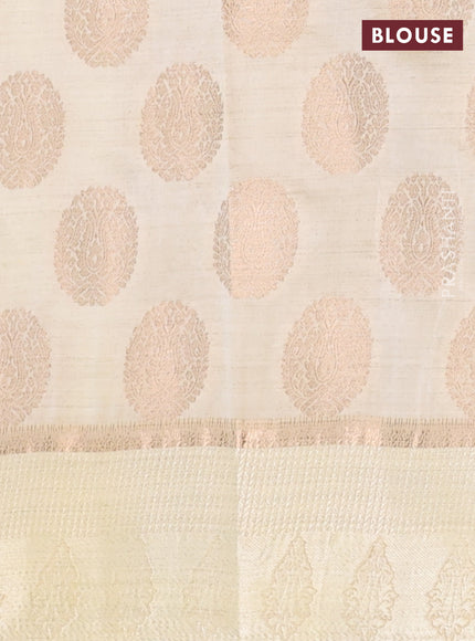Semi raw silk saree cream with zari woven buttas and zari woven simple border