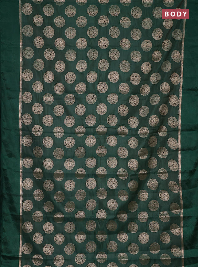 Semi raw silk saree green with zari woven buttas and zari woven simple border