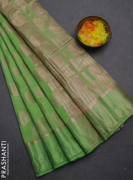 Semi raw silk saree light green with zari woven buttas and zari woven simple border