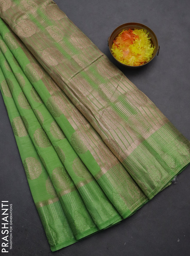 Semi raw silk saree light green with zari woven buttas and zari woven simple border