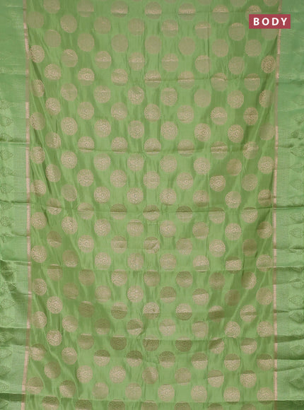 Semi raw silk saree light green with zari woven buttas and zari woven simple border