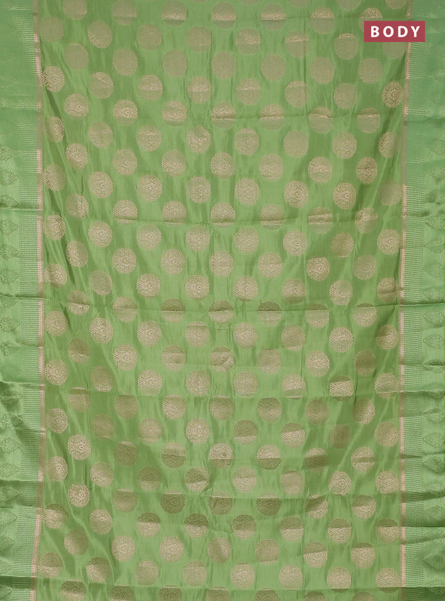 Semi raw silk saree light green with zari woven buttas and zari woven simple border