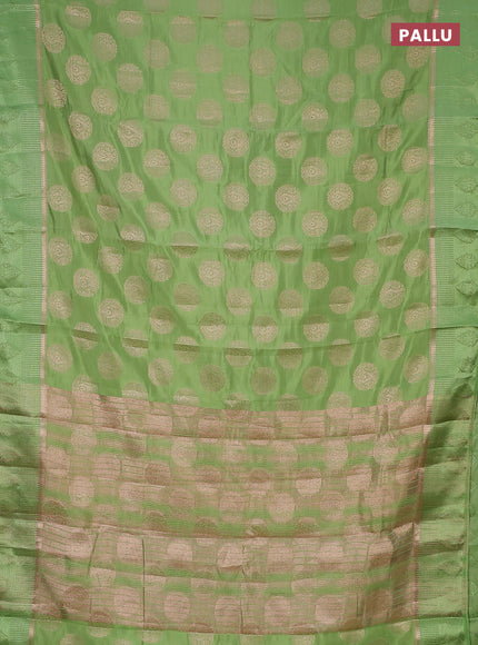 Semi raw silk saree light green with zari woven buttas and zari woven simple border