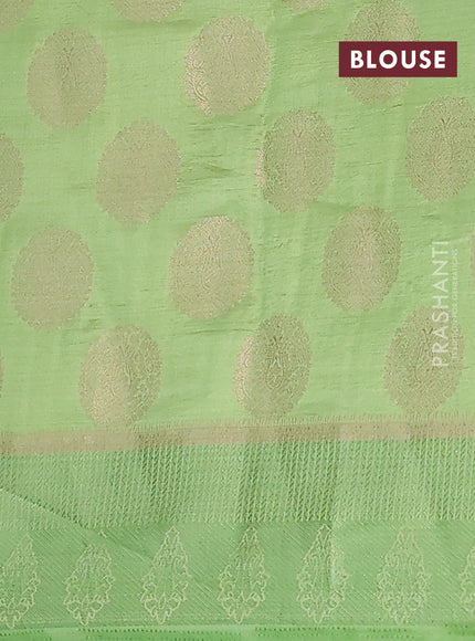 Semi raw silk saree light green with zari woven buttas and zari woven simple border