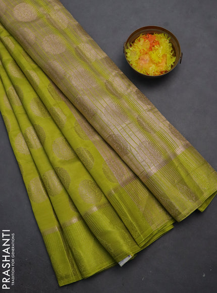 Semi raw silk saree lime green with zari woven buttas and zari woven simple border