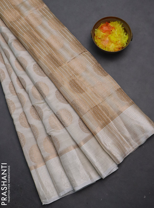 Semi raw silk saree off white with zari woven buttas and zari woven simple border