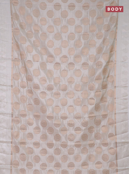 Semi raw silk saree off white with zari woven buttas and zari woven simple border