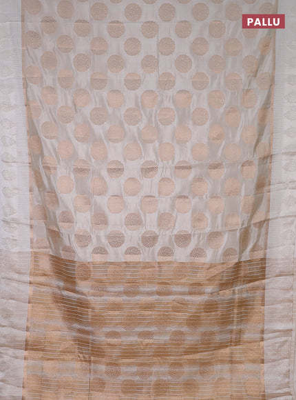 Semi raw silk saree off white with zari woven buttas and zari woven simple border