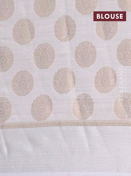 Semi raw silk saree off white with zari woven buttas and zari woven simple border