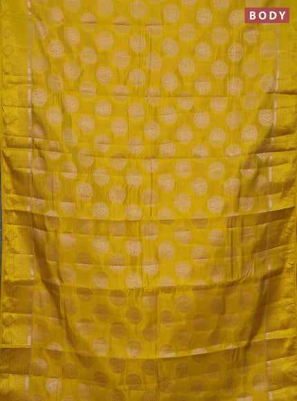 Semi raw silk saree yellow with zari woven buttas and zari woven simple border