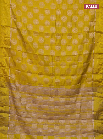 Semi raw silk saree yellow with zari woven buttas and zari woven simple border