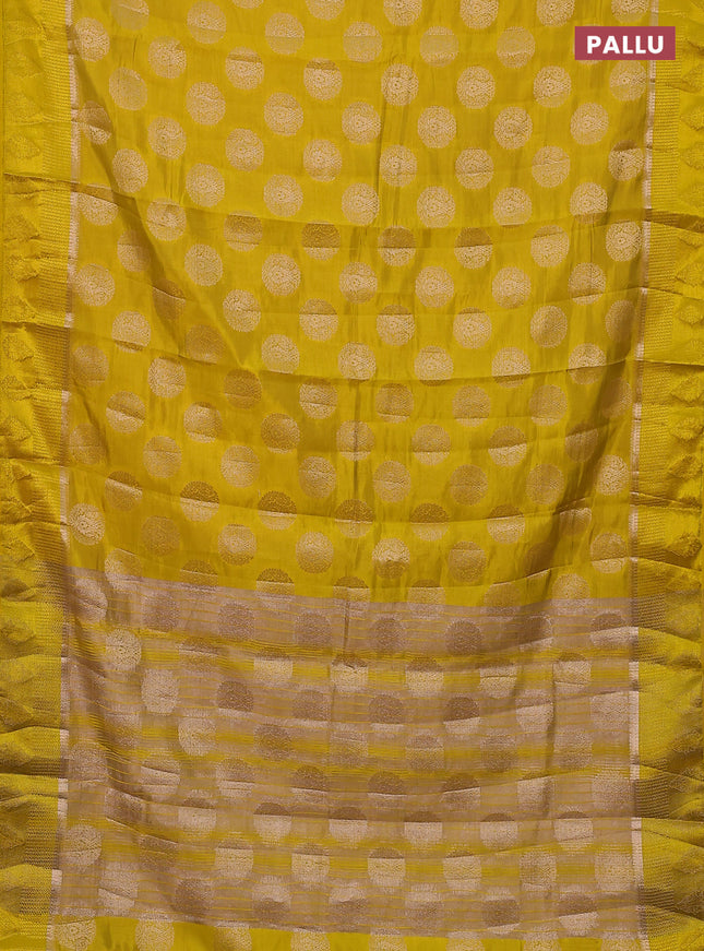 Semi raw silk saree yellow with zari woven buttas and zari woven simple border