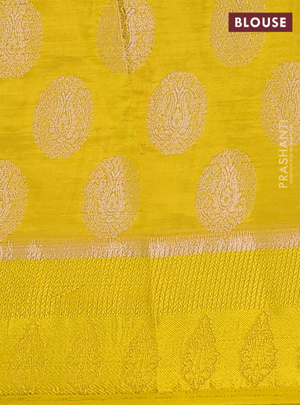 Semi raw silk saree yellow with zari woven buttas and zari woven simple border