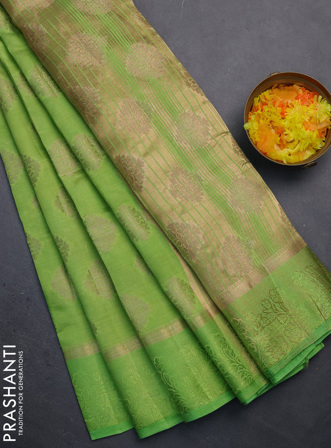 Semi raw silk saree light green with zari woven buttas and zari woven simple border
