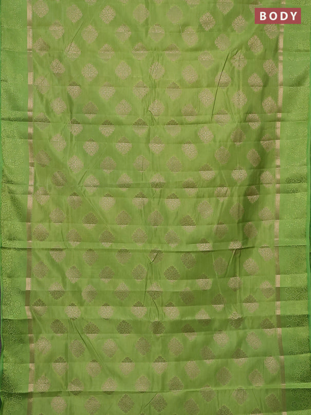 Semi raw silk saree light green with zari woven buttas and zari woven simple border