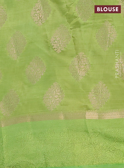 Semi raw silk saree light green with zari woven buttas and zari woven simple border