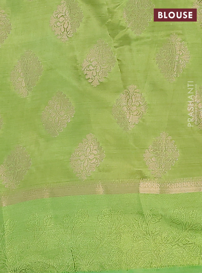 Semi raw silk saree light green with zari woven buttas and zari woven simple border
