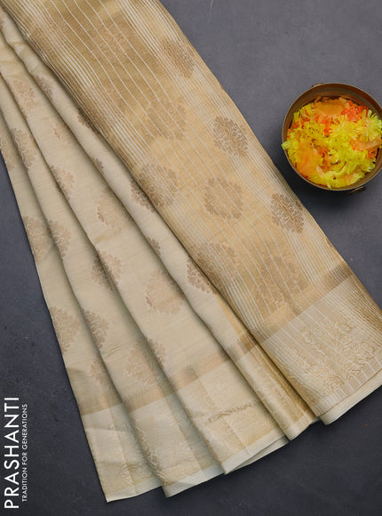 Semi raw silk saree cream with zari woven buttas and zari woven simple border