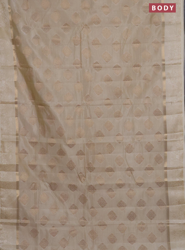 Semi raw silk saree cream with zari woven buttas and zari woven simple border