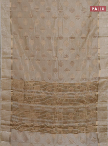 Semi raw silk saree cream with zari woven buttas and zari woven simple border