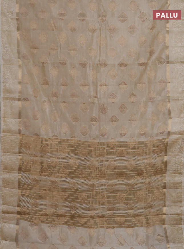 Semi raw silk saree cream with zari woven buttas and zari woven simple border
