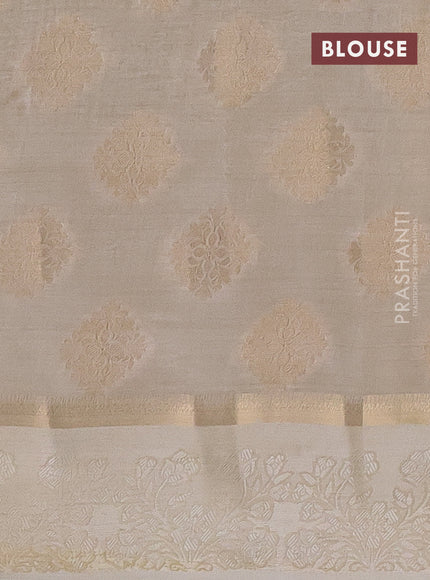 Semi raw silk saree cream with zari woven buttas and zari woven simple border