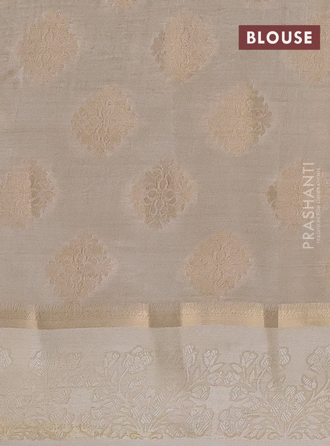 Semi raw silk saree cream with zari woven buttas and zari woven simple border