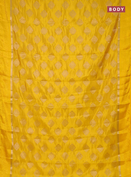 Semi raw silk saree yellow with zari woven buttas and zari woven simple border