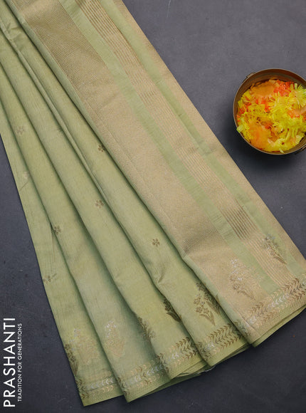 Semi raw silk saree pista green with zari woven buttas and zari woven border