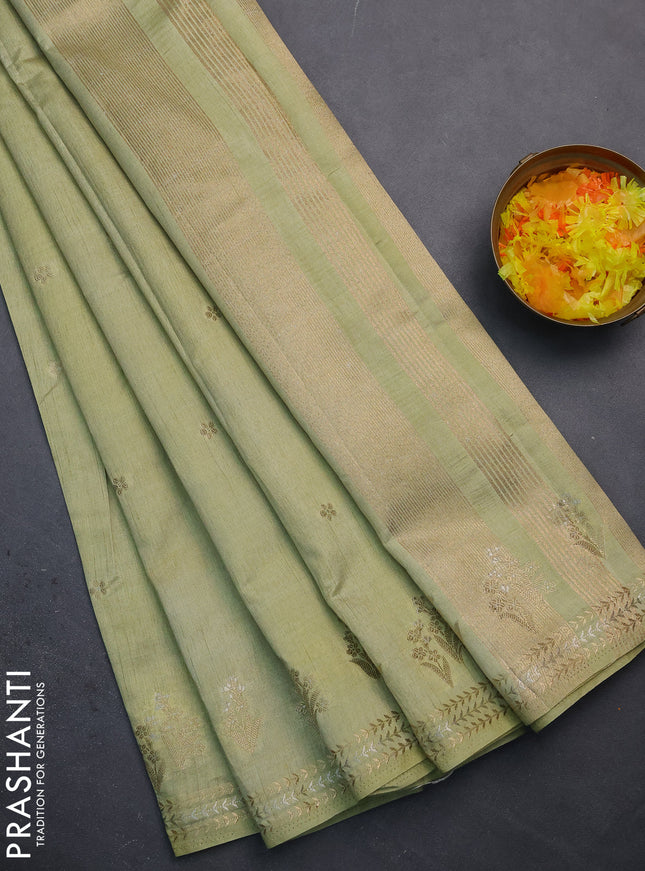 Semi raw silk saree pista green with zari woven buttas and zari woven border