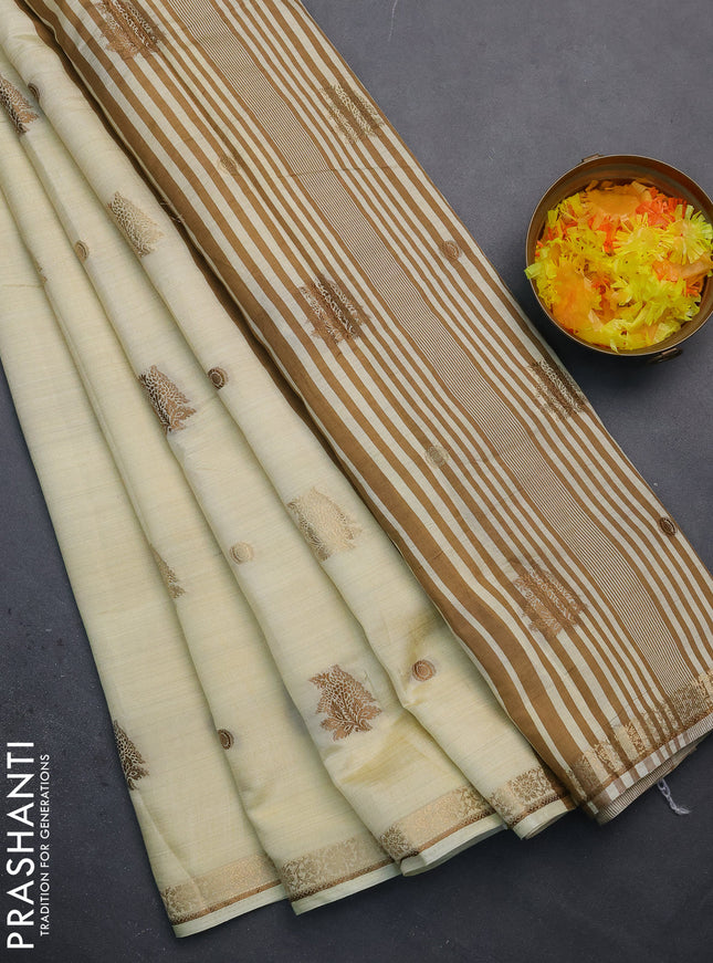 Semi raw silk saree cream with woven buttas and zari woven border
