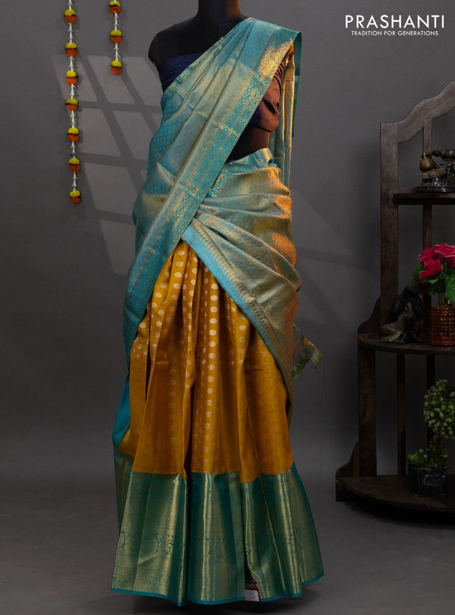 Pure kanchipuram silk lehenga mustard yellow and teal blue with allover zari woven buttas and long annam zari woven border