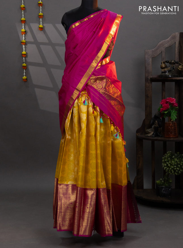 Pure kanchipuram silk lehenga yellow and pink with allover silver zari woven annam mayil chakkaram buttas and long annam zari woven border