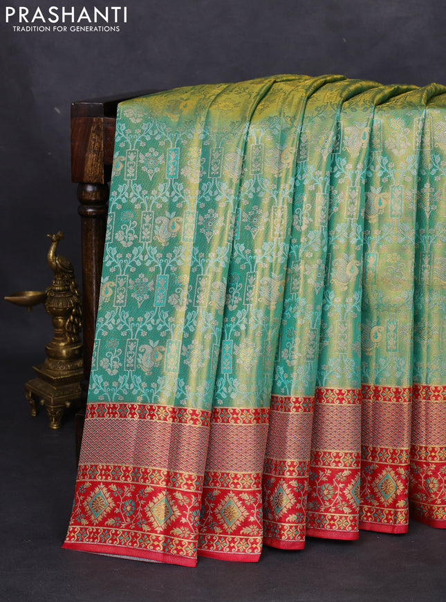 Pure kanchipuram tissue silk saree teal green and pink with allover zari woven brocade pattern and rich zari minakari border