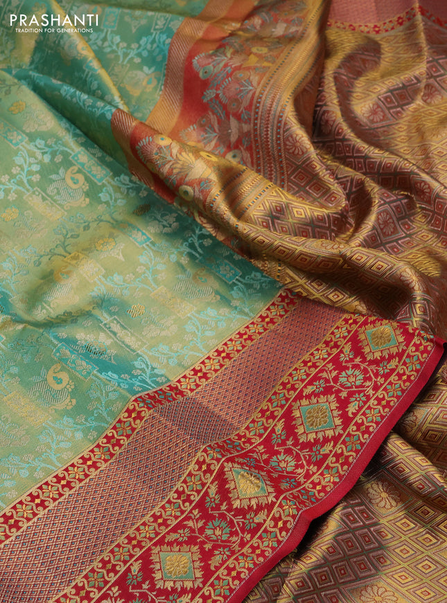 Pure kanchipuram tissue silk saree teal green and pink with allover zari woven brocade pattern and rich zari minakari border
