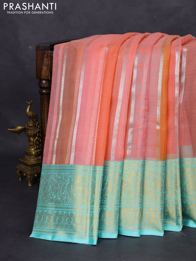 Kanchipuram kora silk saree peach shade and teal blue with allover silver zari weaves and zari woven border