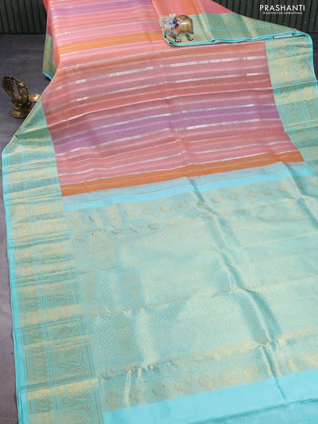 Kanchipuram kora silk saree peach shade and teal blue with allover silver zari weaves and zari woven border