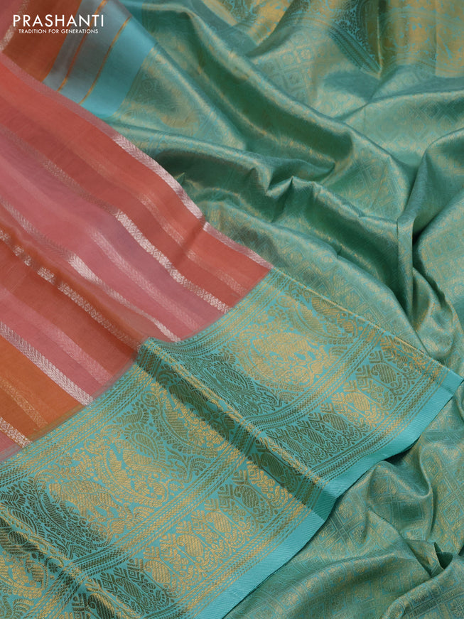 Kanchipuram kora silk saree peach shade and teal blue with allover silver zari weaves and zari woven border