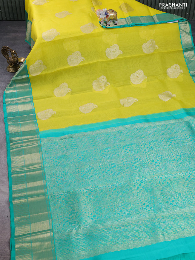 Kanchipuram kora silk saree lime yellow and green with zari woven paisley buttas and zari woven border