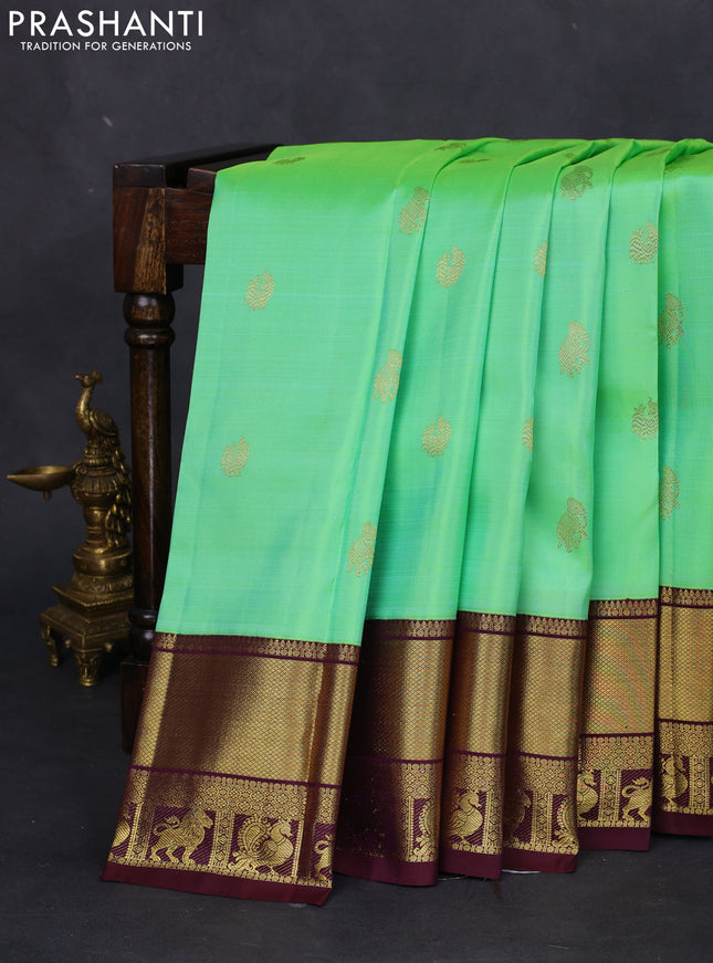 Pure kanchipuram silk saree teal green and wine shade with zari woven buttas and zari woven korvai border