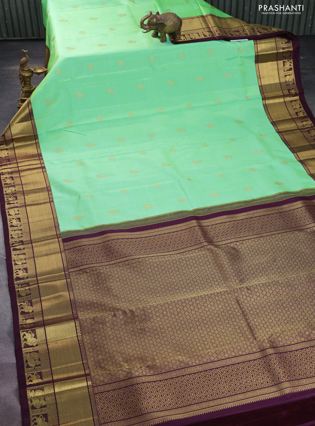 Pure kanchipuram silk saree teal green and wine shade with zari woven buttas and zari woven korvai border